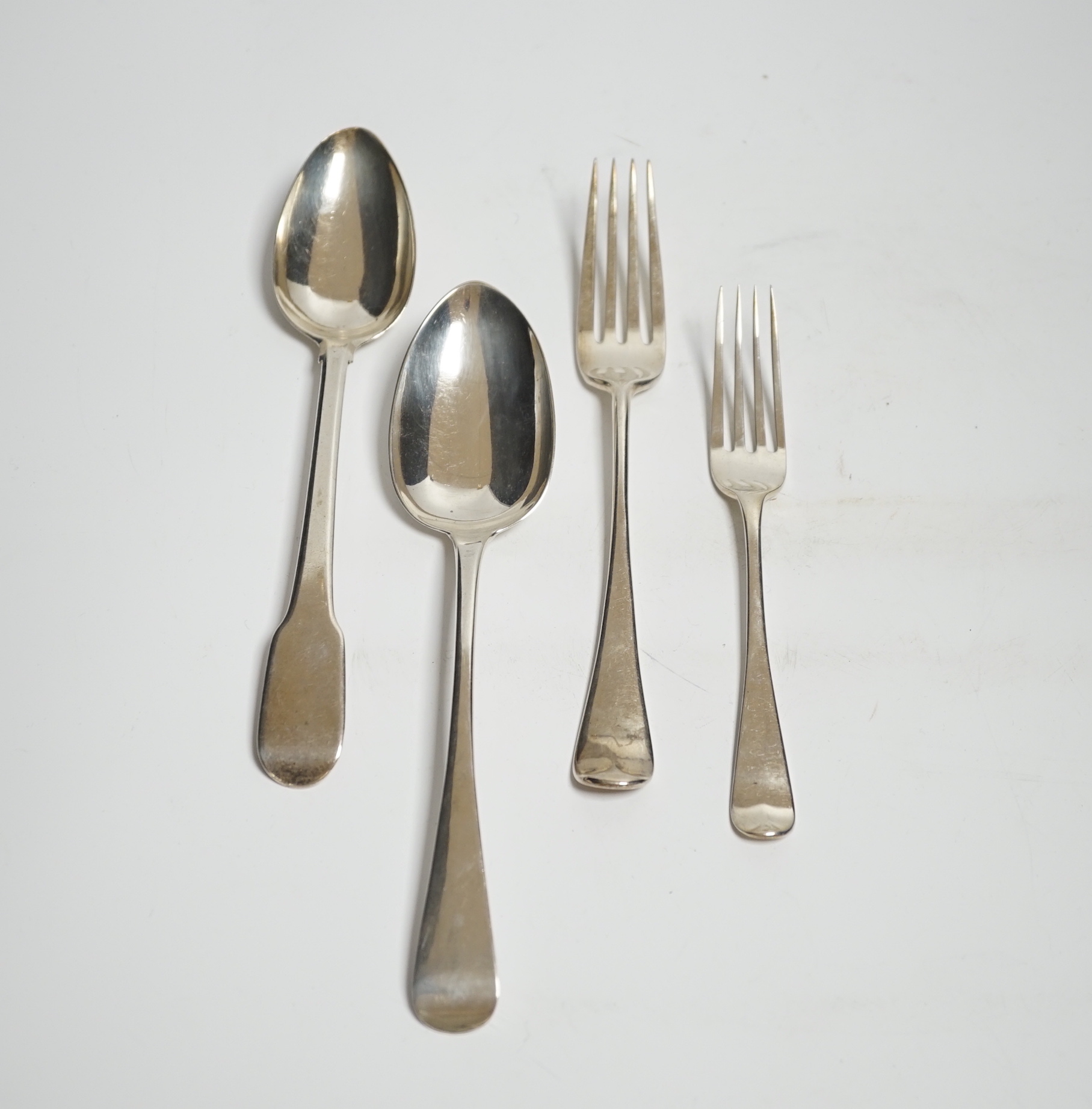 A set of six late Victorian silver Hanovarian pattern table forks, London, 1897, a set of six Old English pattern dessert spoons, London, 1851 and nine other items of silver flatware including a spoon stamped IG three ti